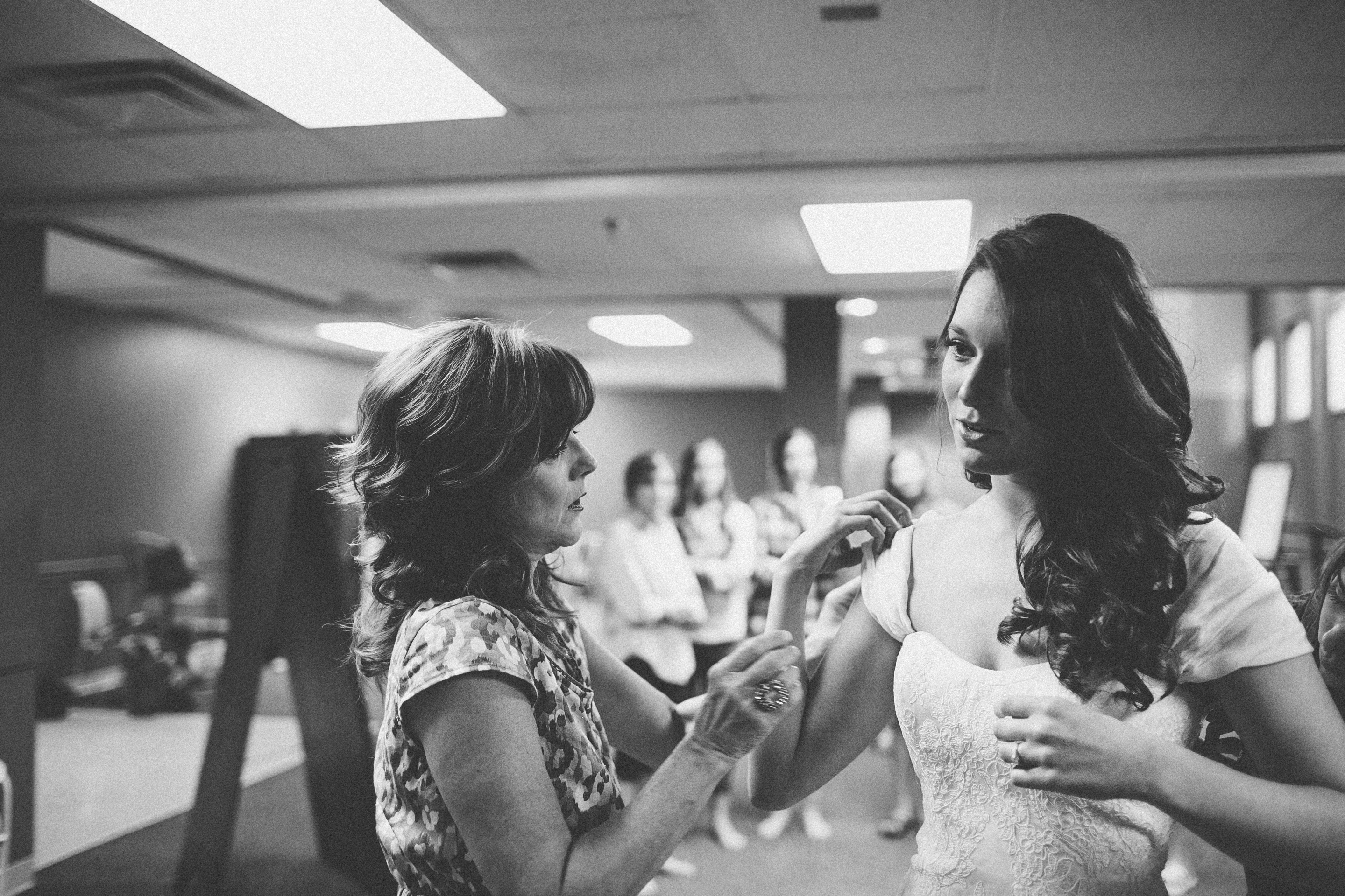 bride-putting-on-dress