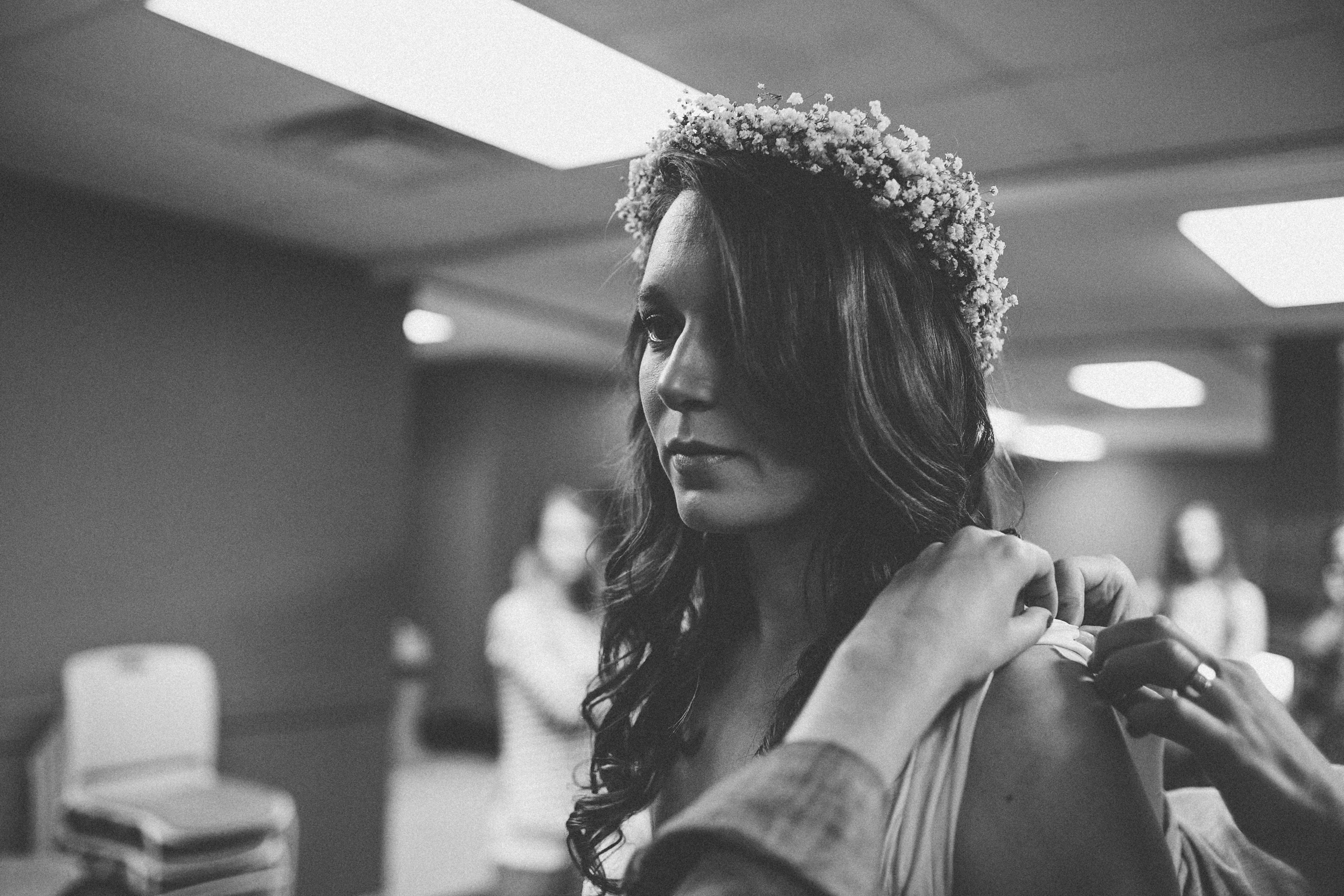bride-putting-on-dress