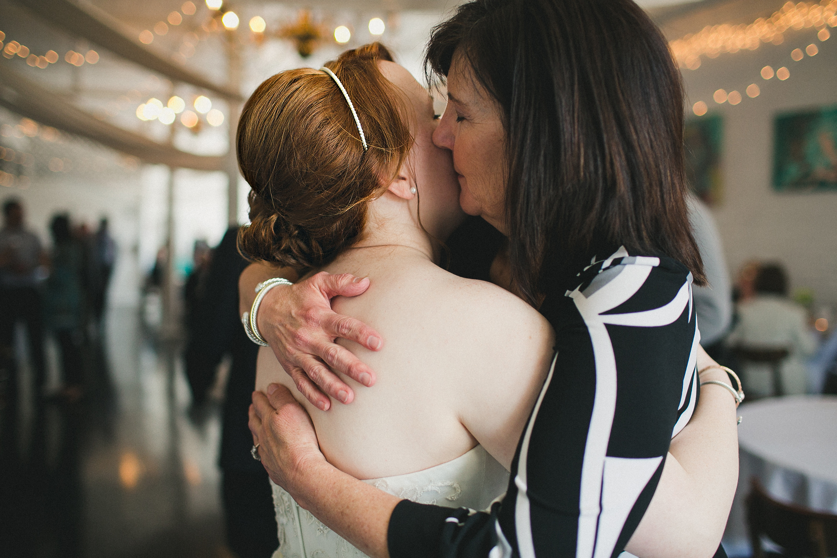 wedding guests greeting bride