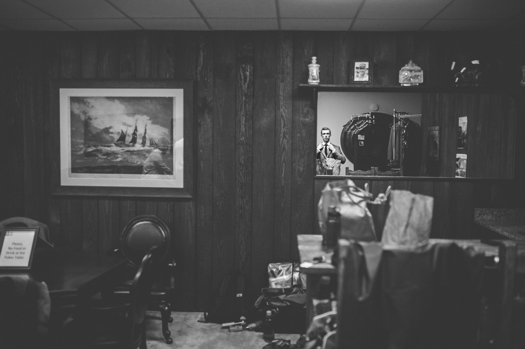 groom looking in mirror 