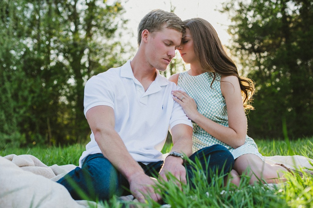 romantic casual engagement photos in a field