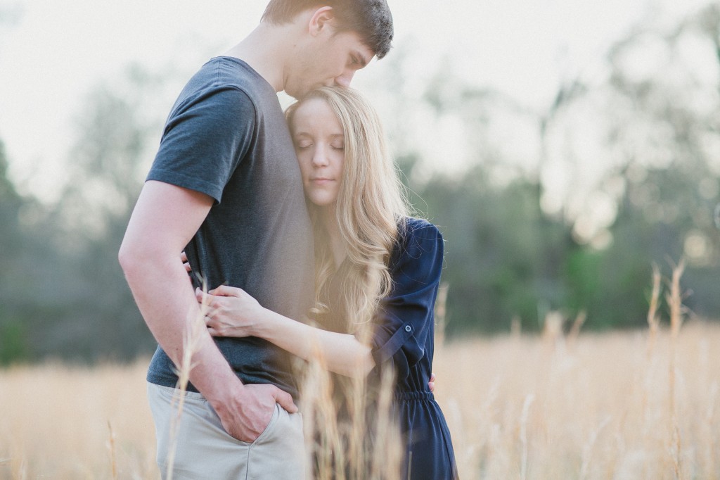 engagement photos in a field, rural engagement photos, rust engagement photos, Tennessee wedding photography, Kelly Ginn Photography,  romantic engagement photos, creative engagement photos, intimate engagement photos, candid engagement photos