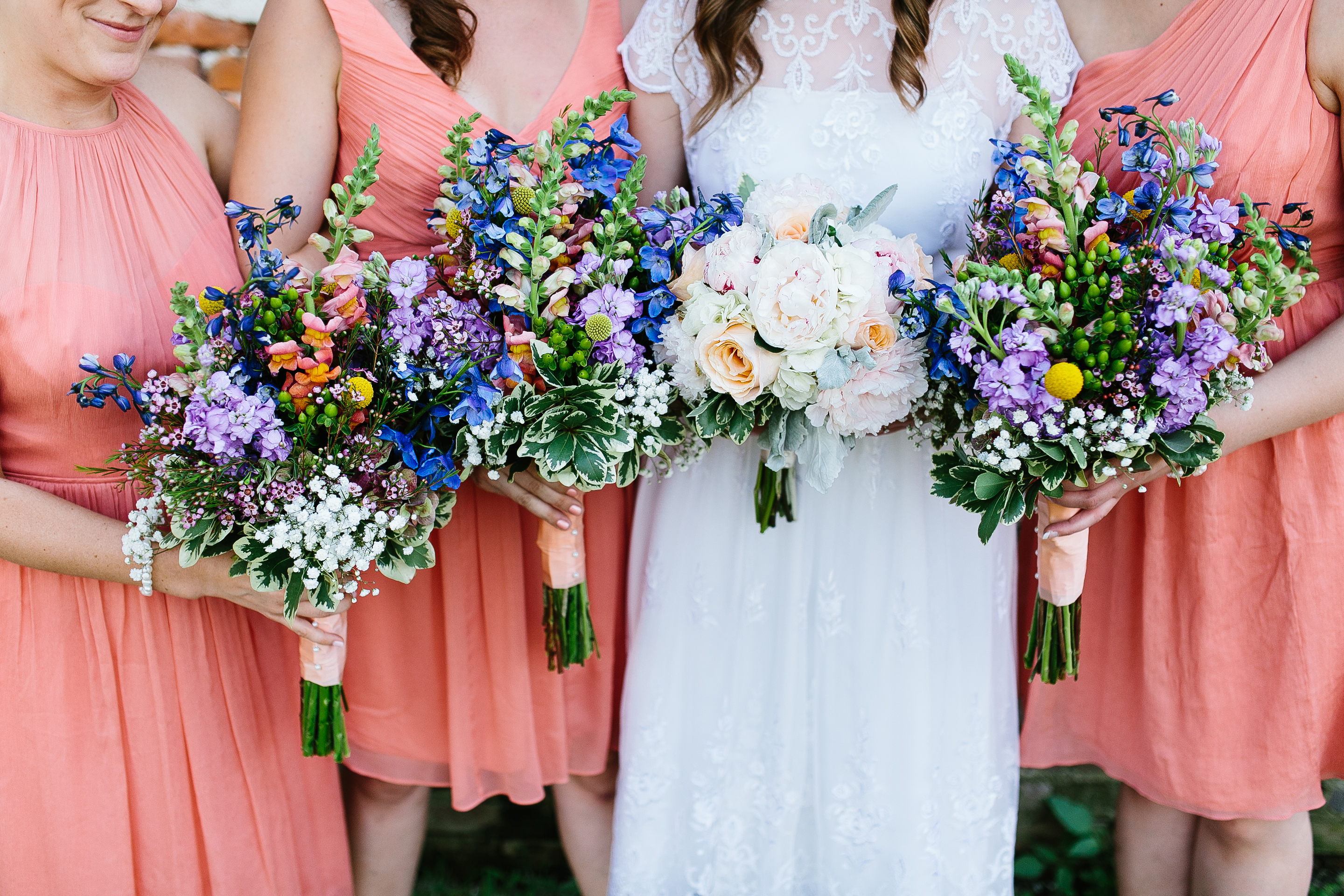 peach bridesmaids dresses. vibrant bouquets. flower crown