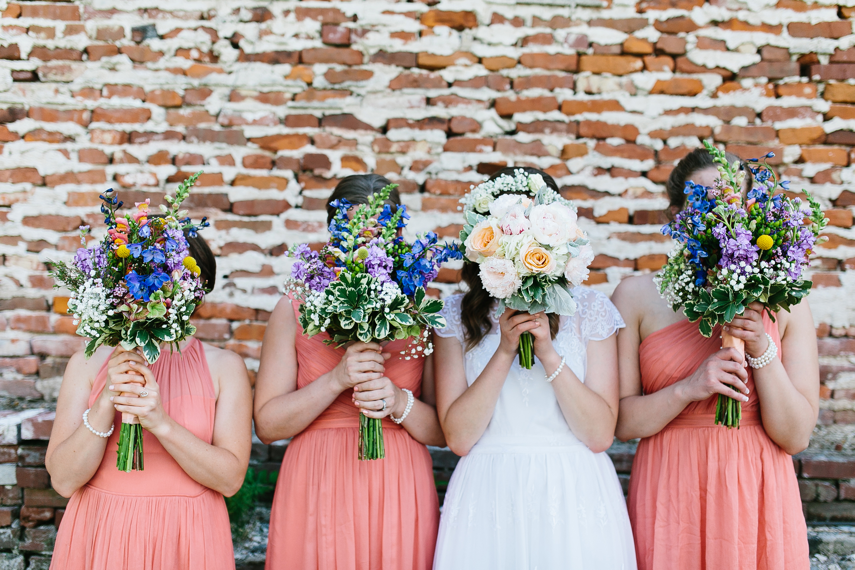 peach bridesmaids dresses. vibrant bouquets. flower crown