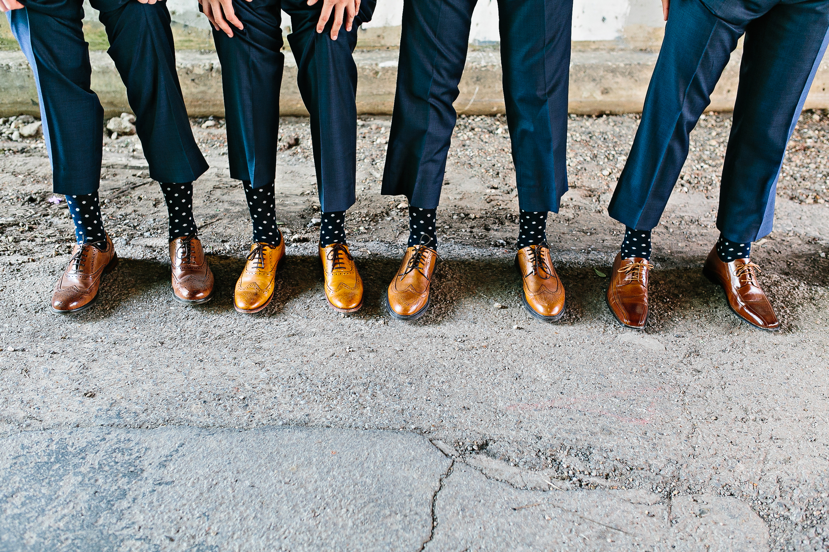 navy groomsmen suits. navy and peach wedding colors. polkadot socks