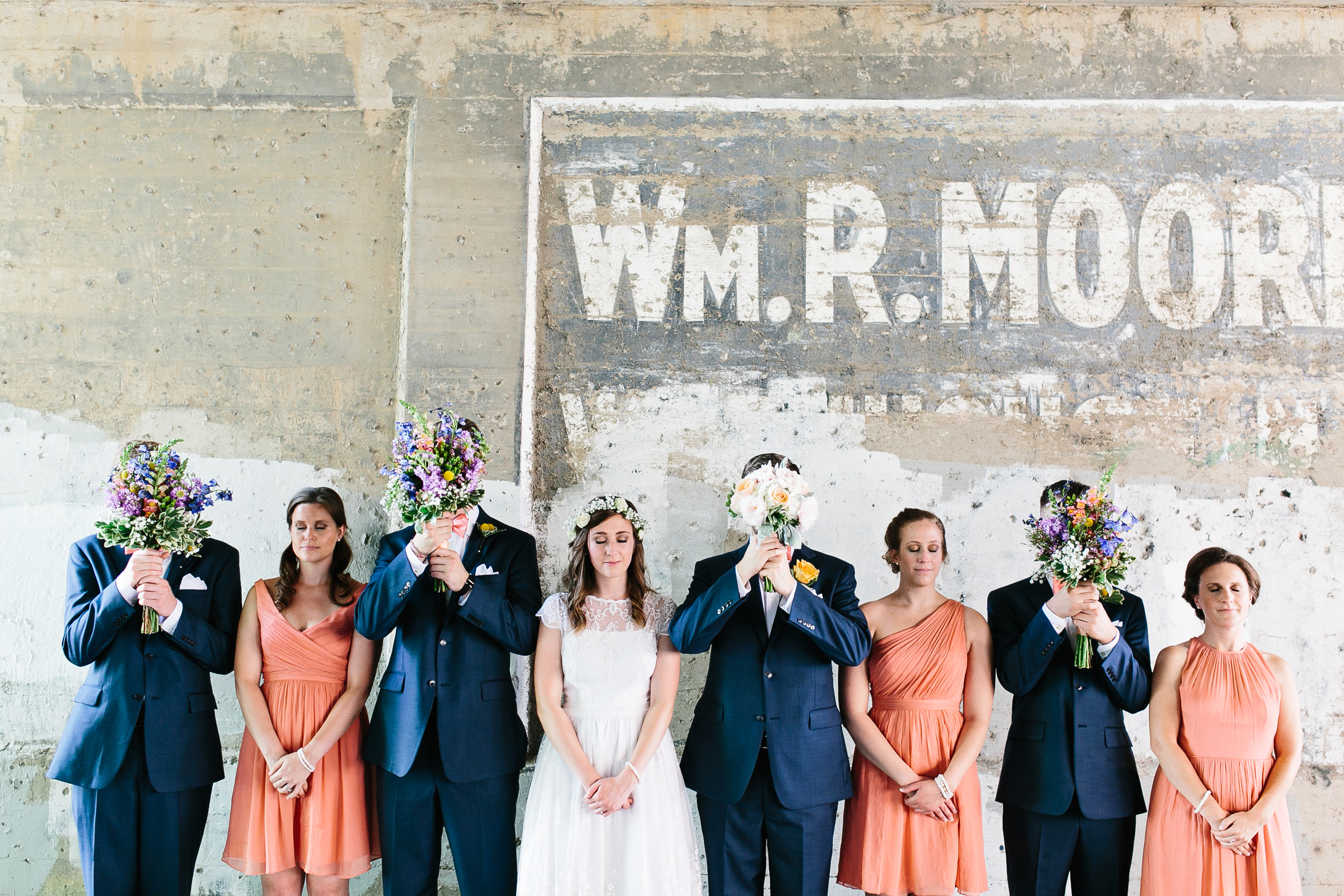 navy groomsmen suits. navy and peach wedding colors