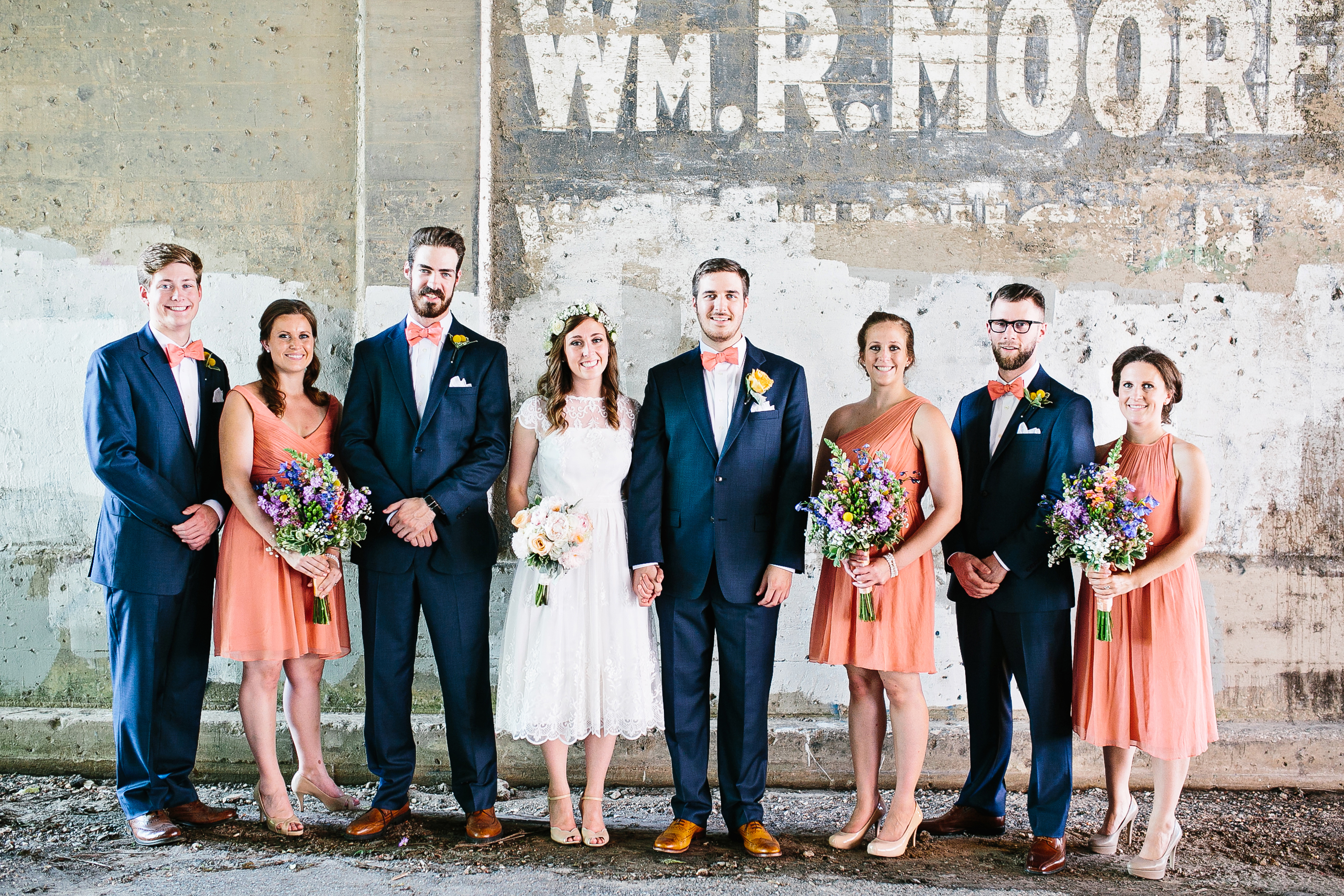 navy groomsmen suits. navy and peach wedding colors