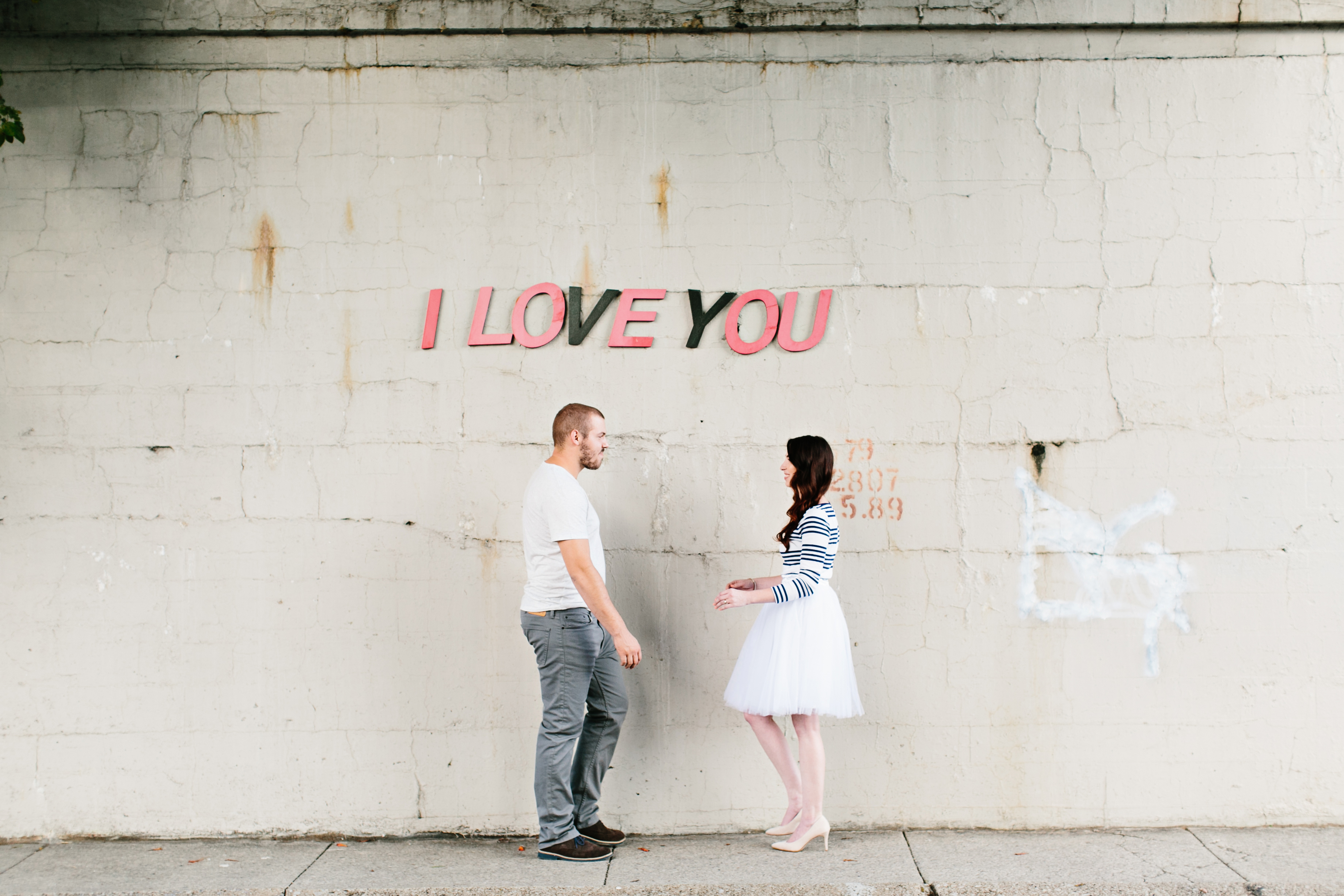 creative engagement photos. Urban engagement session, midtown engagement session. Journalistic wedding photographer. Tulle skirt