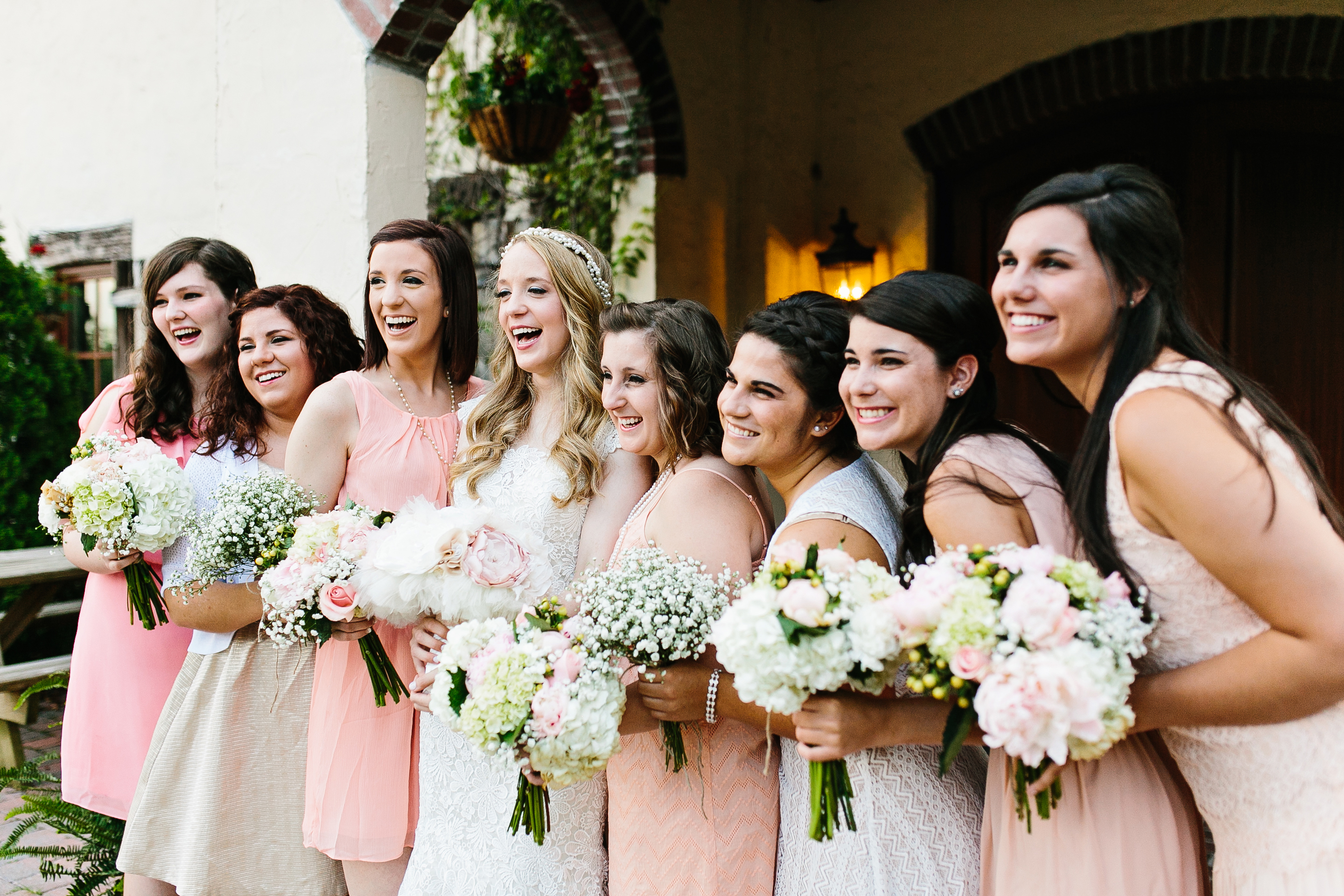 shades of coral bridesmaids dresses. bridesmaids in coral. coral wedding colors. shades of coral wedding. coral wedding. peach wedding colors.