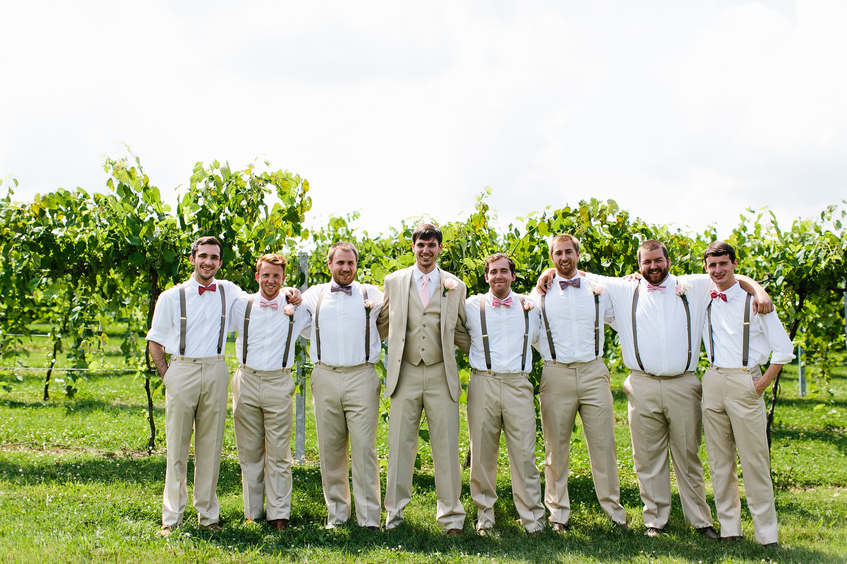 groomsmen with suspenders. causal groomsmen attire. groomsmen