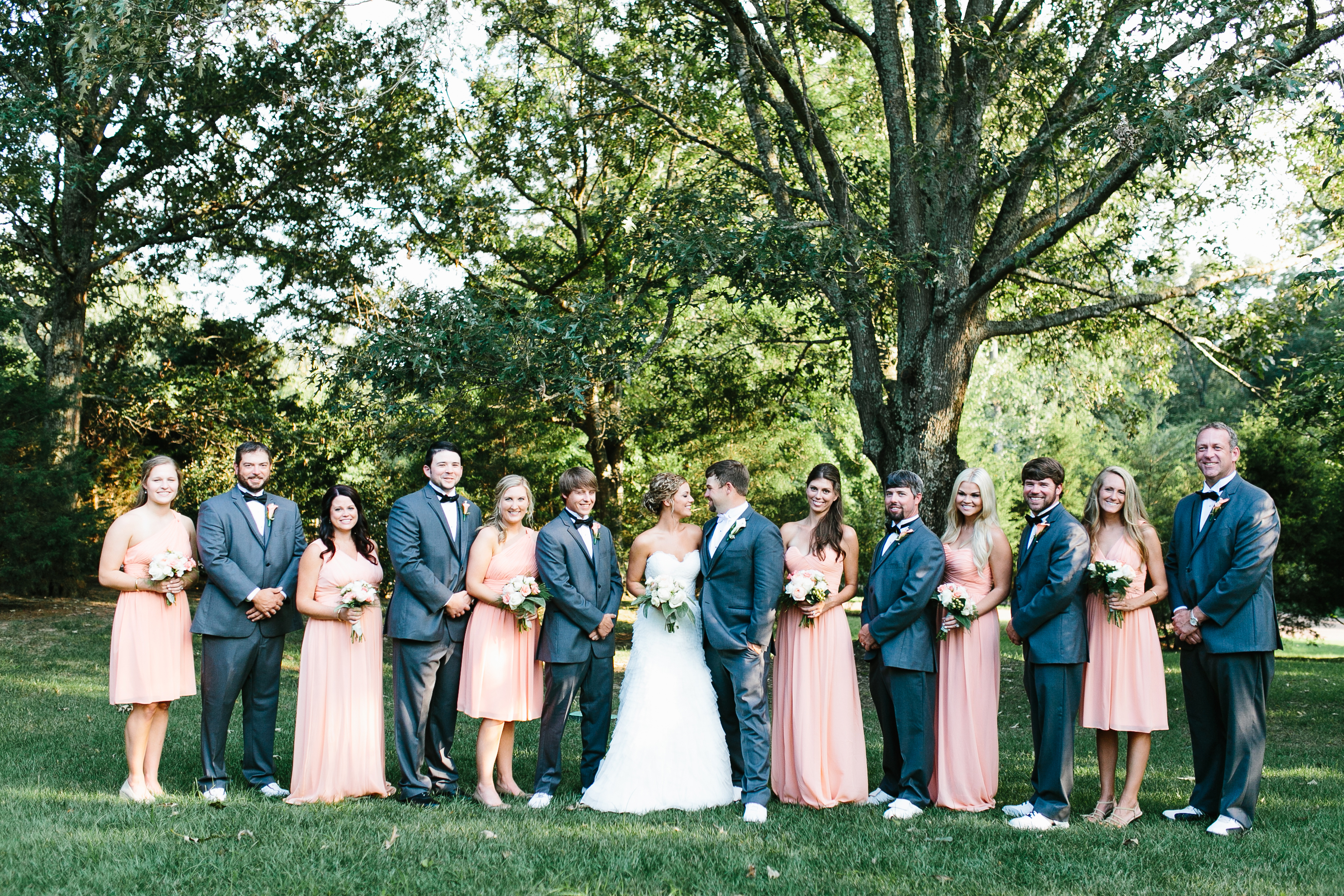 creative wedding photos. intimate wedding photography. tennessee wedding photography. peach bridal party. bridesmaids in coral dresses