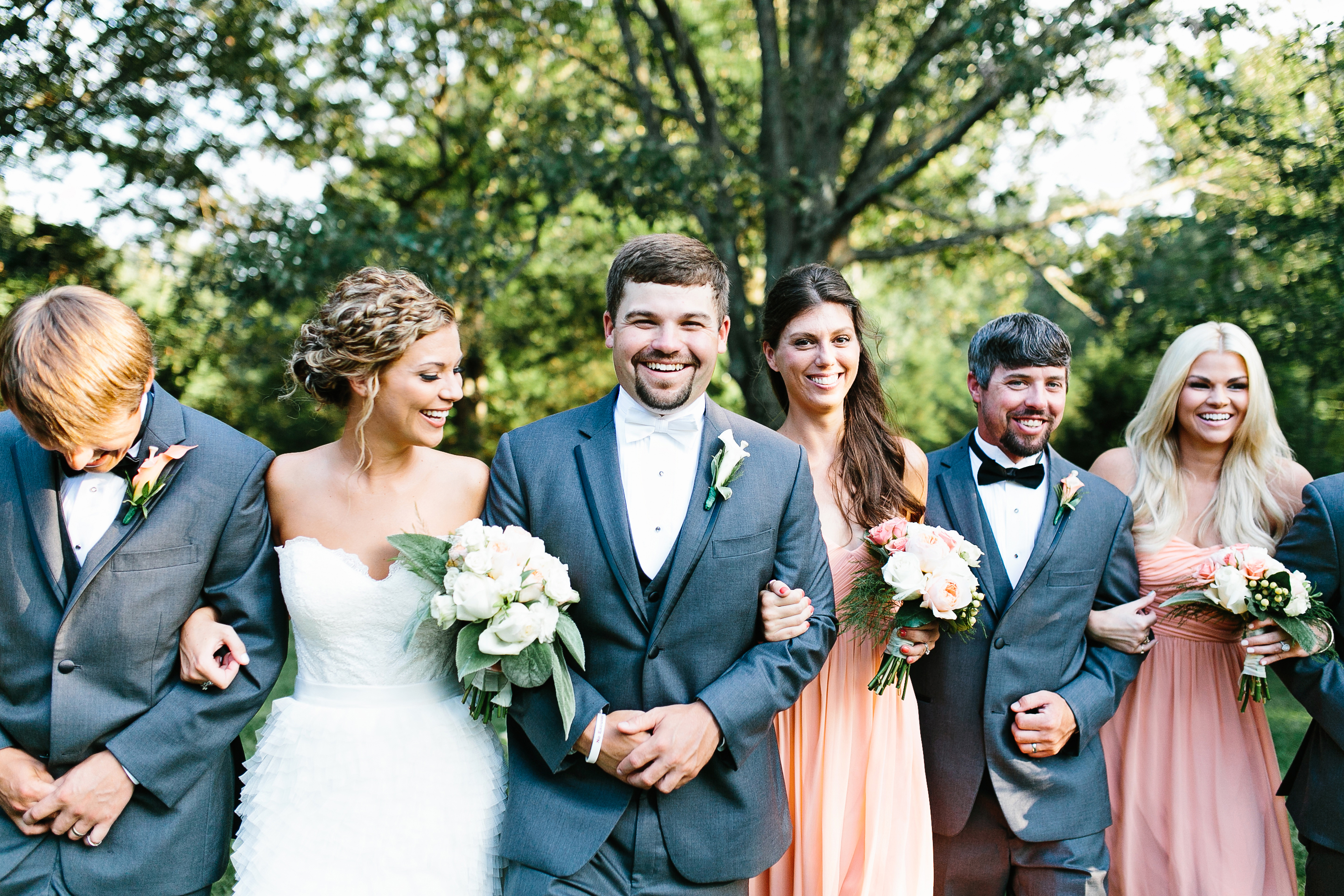 creative wedding photos. intimate wedding photography. tennessee wedding photography. peach bridal party. bridesmaids in coral dresses