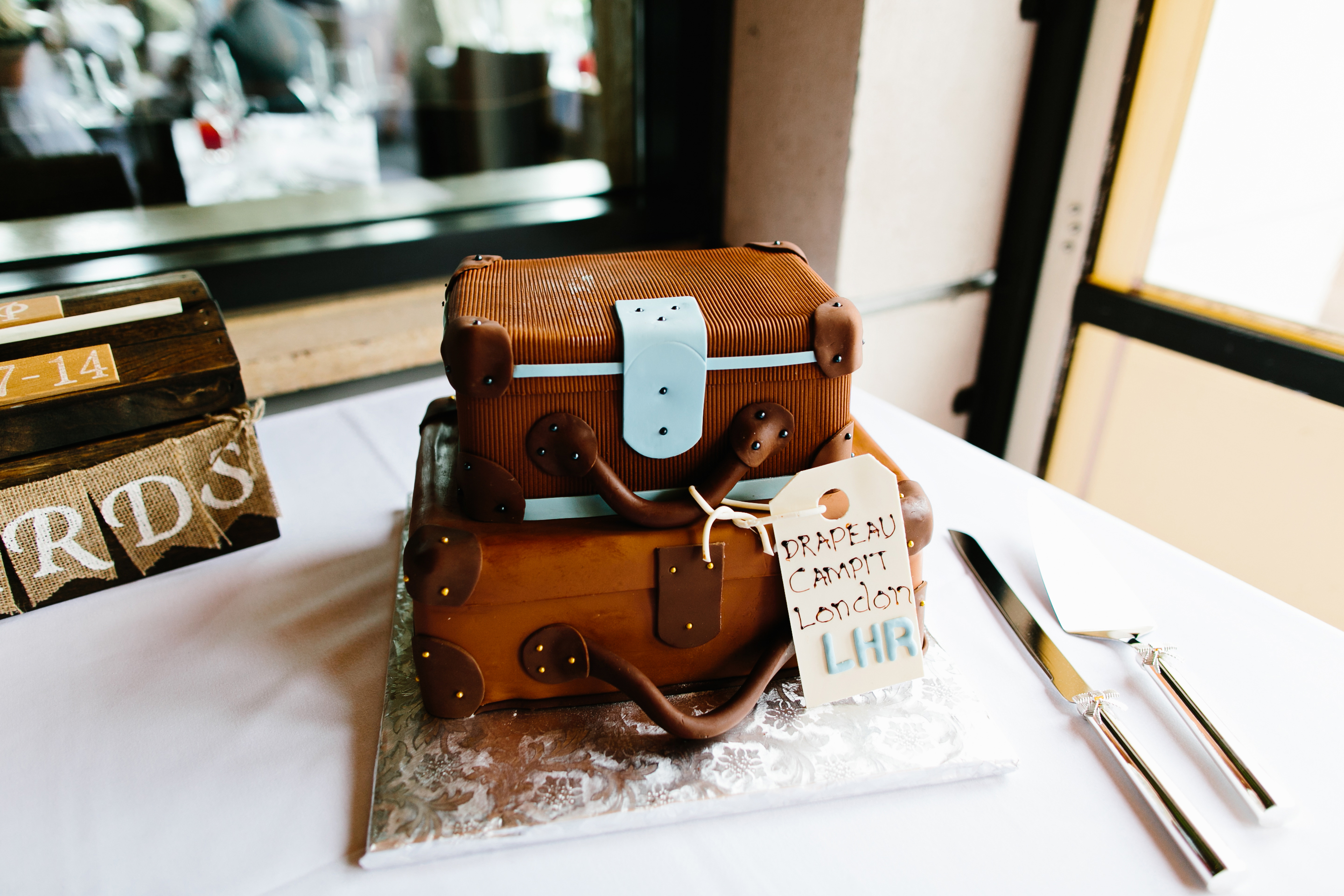 Epic Roasthouse San Francisco. San Francisco wedding photographer. Epic Roasthouse wedding reception. Suitcase wedding cake.