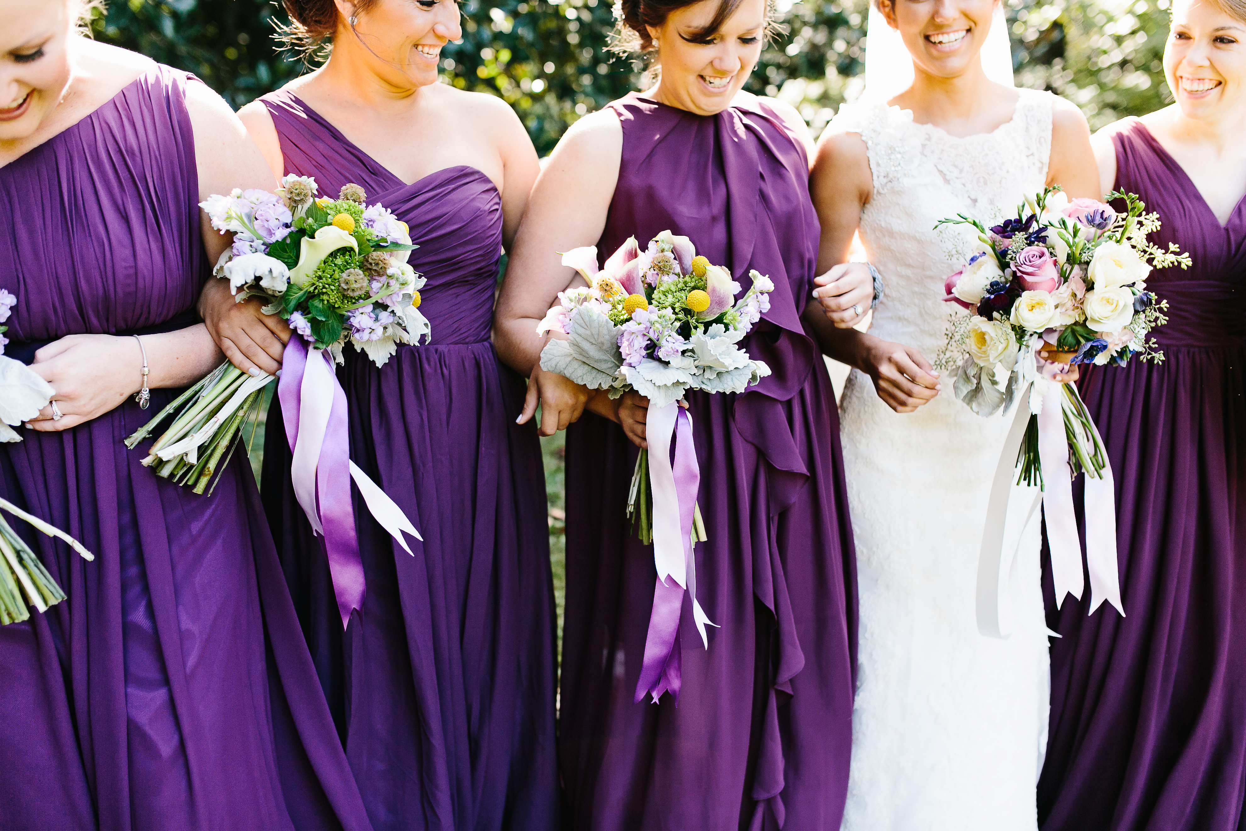 bride with bridesmaids. purple and grey wedding. deep purple wedding