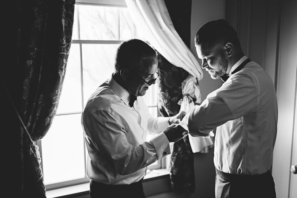 dad-helping-groom-get-ready