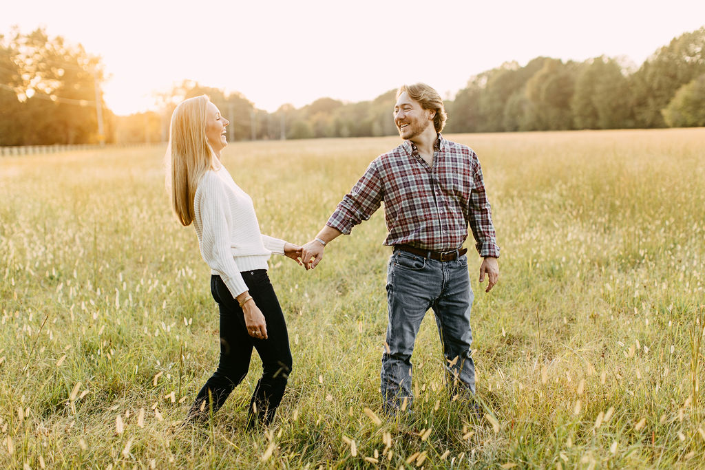fall engagement photos in a field